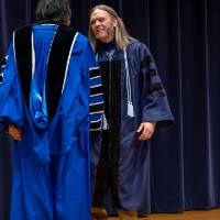 Awardee shaking President Mantella's hand
